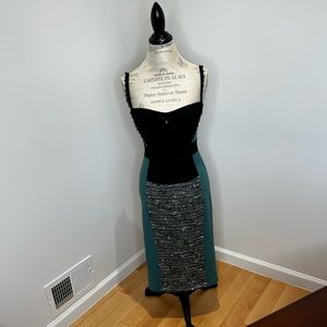 Beautiful dress by Italian designer. Featuring straps and body hugging skirts,